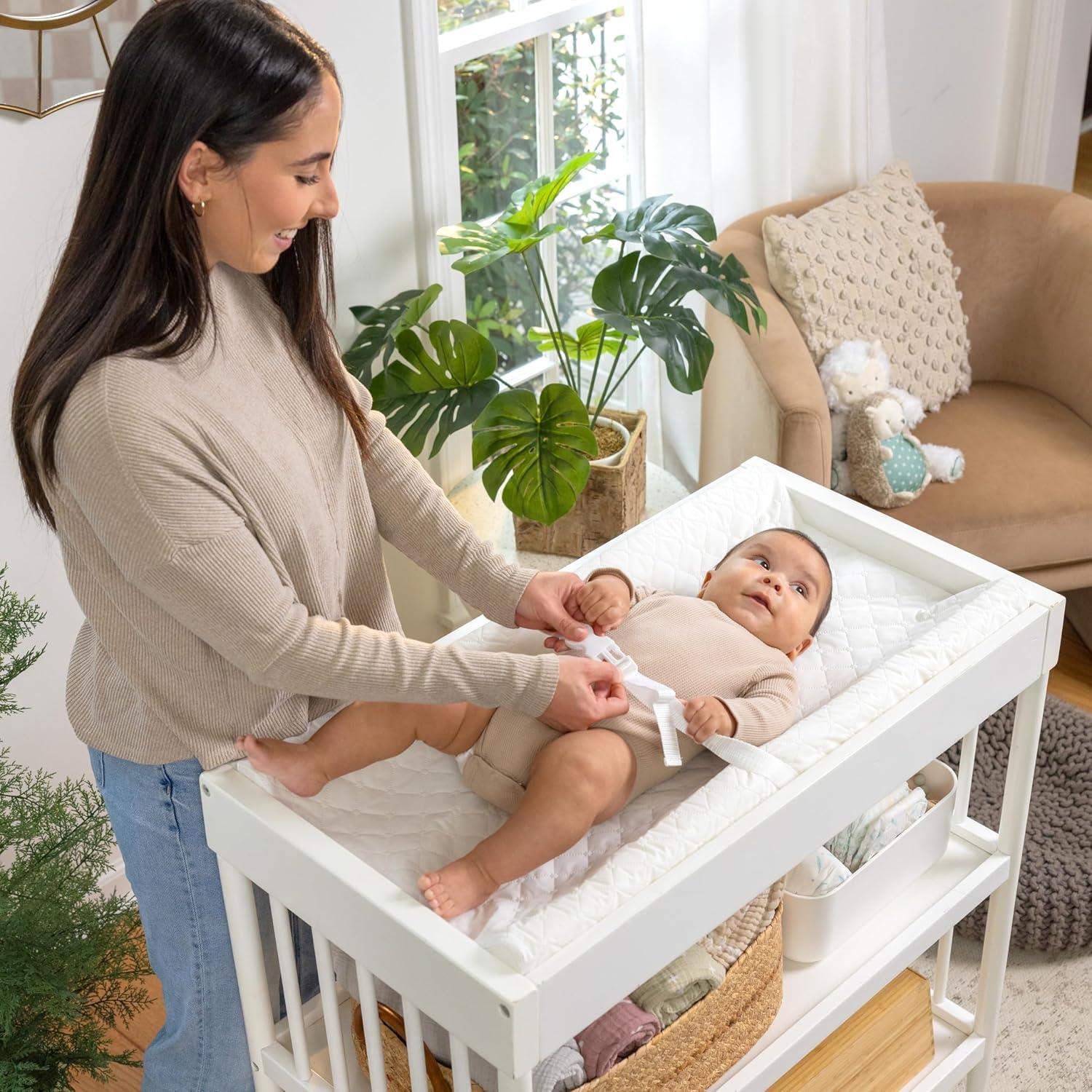 imageIngenuity Contoured Changing Pad Includes Waterproof Changing Liner and Safety Fastening Strap with QuickRelease BuckleContoured Pad