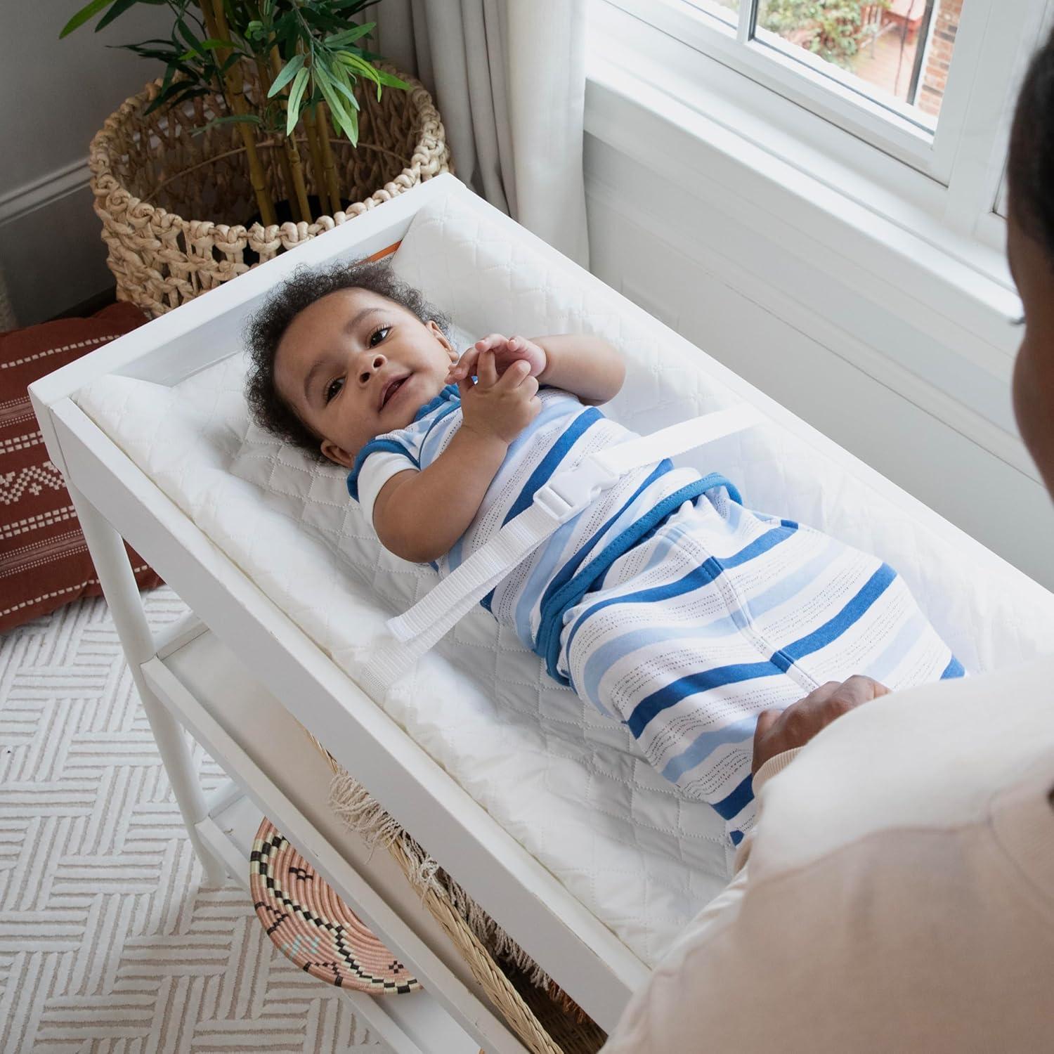 imageIngenuity Contoured Changing Pad Includes Waterproof Changing Liner and Safety Fastening Strap with QuickRelease BuckleContoured Pad