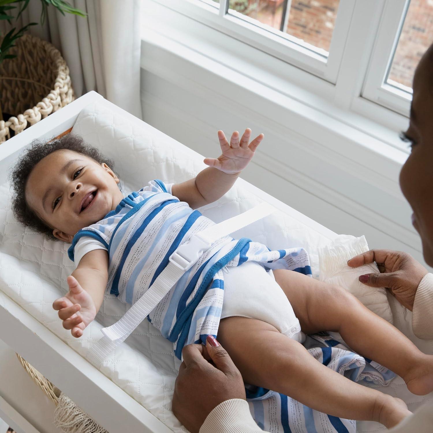 imageIngenuity Contoured Changing Pad Includes Waterproof Changing Liner and Safety Fastening Strap with QuickRelease BuckleContoured Pad