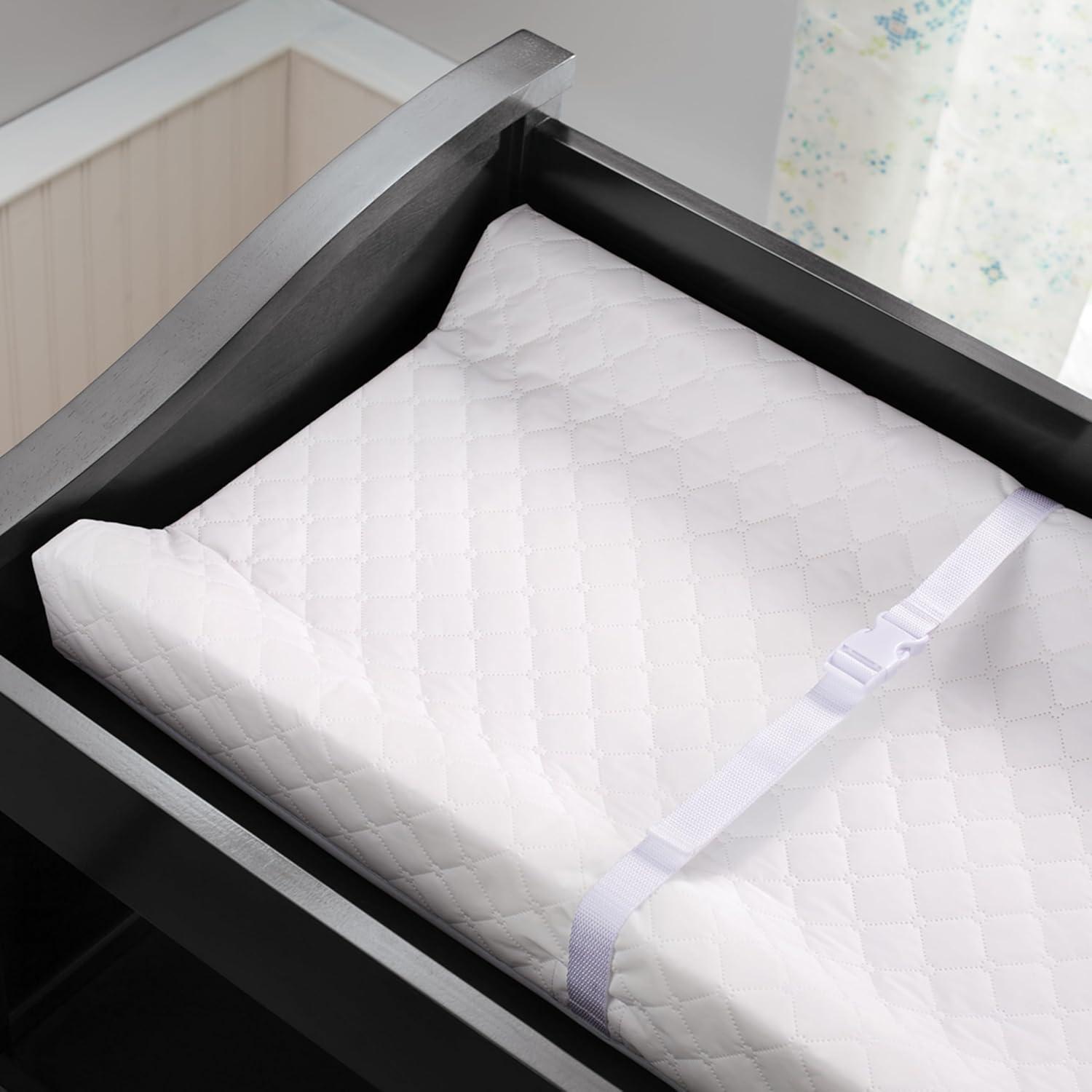 imageIngenuity Contoured Changing Pad Includes Waterproof Changing Liner and Safety Fastening Strap with QuickRelease BuckleContoured Pad
