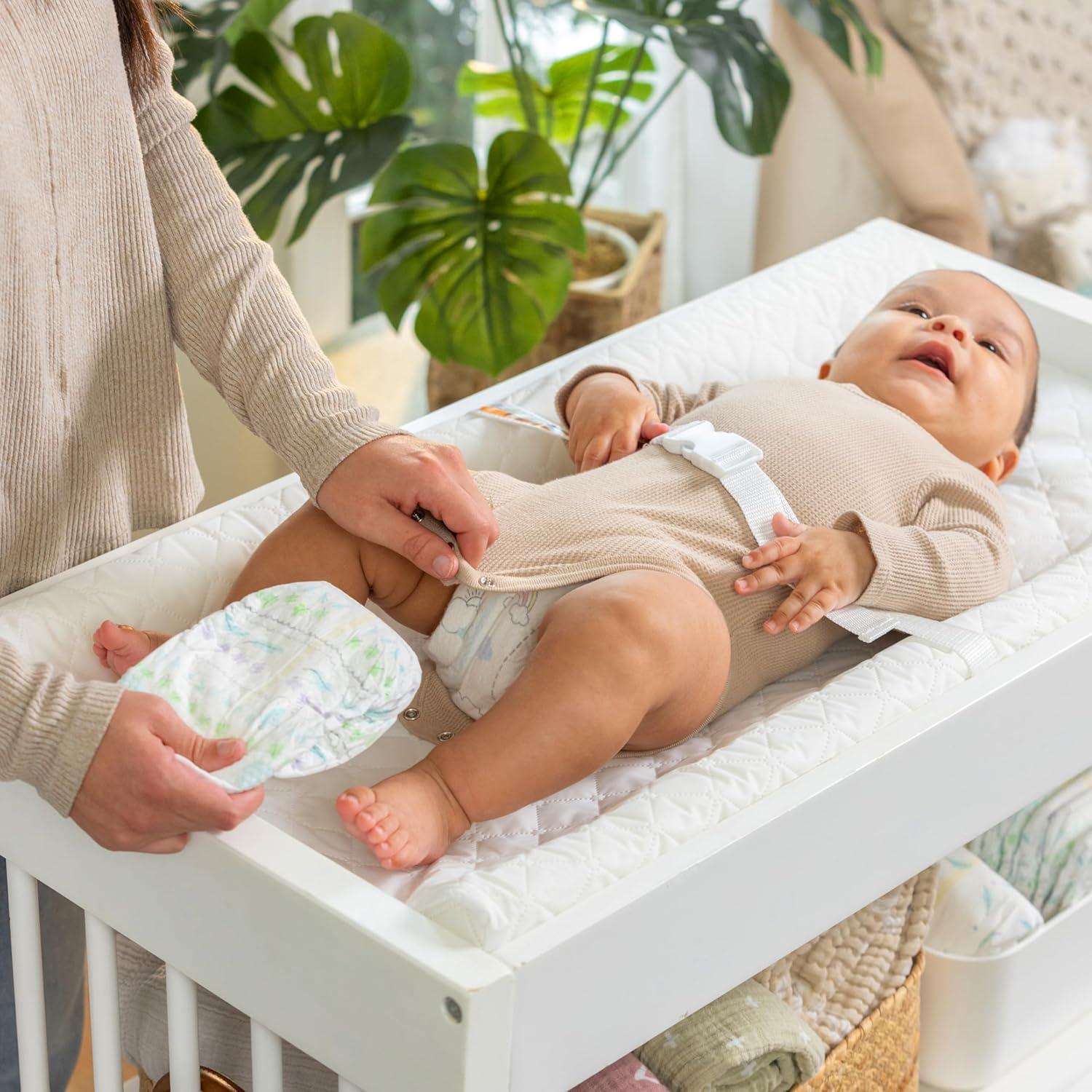 imageIngenuity Contoured Changing Pad Includes Waterproof Changing Liner and Safety Fastening Strap with QuickRelease BuckleContoured Pad